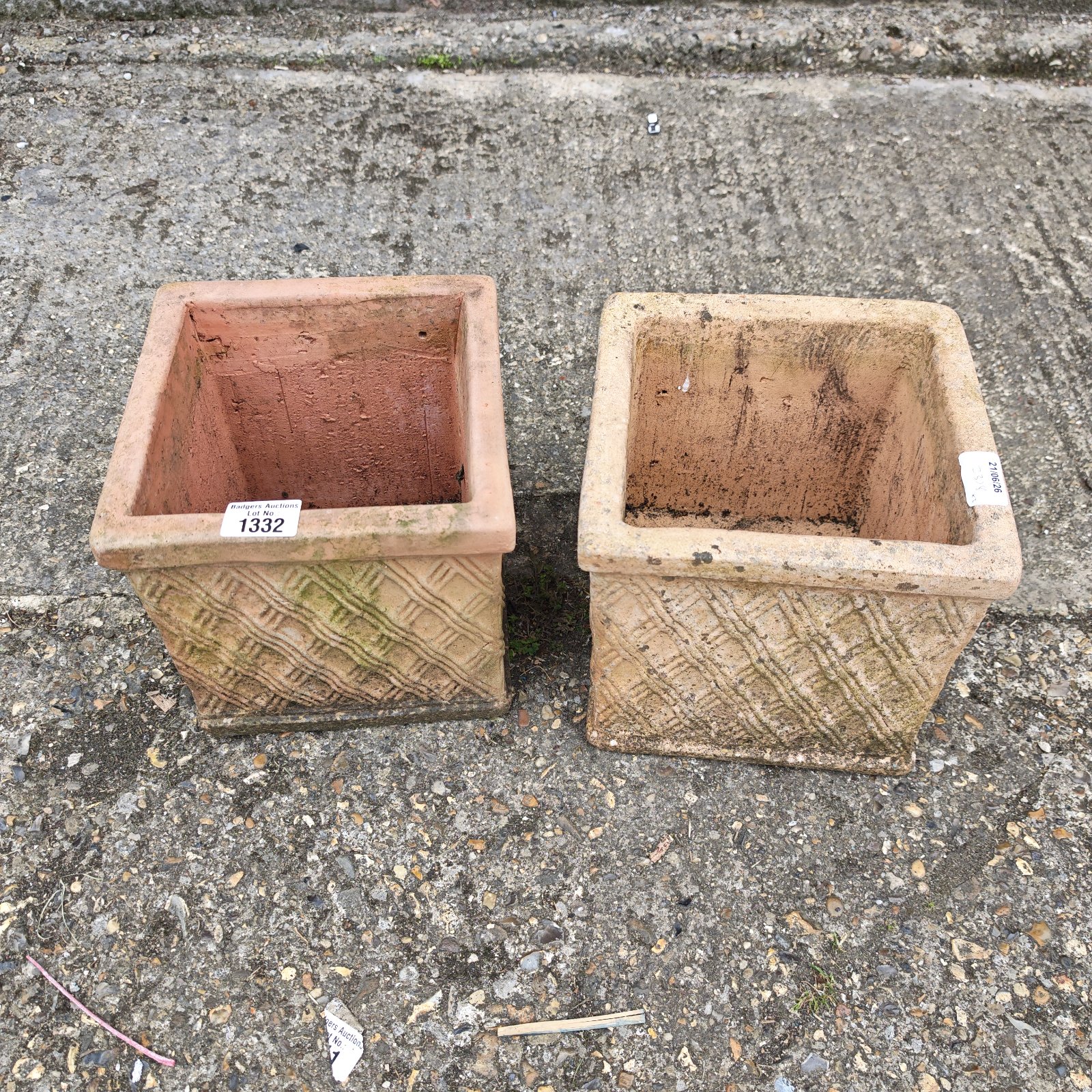 Pair of vintage terracotta plant pots for garden use.