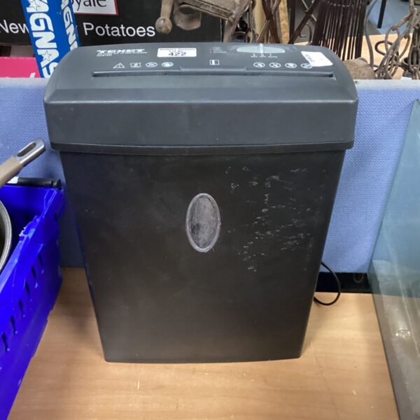 Black Texet paper shredder for secure document destruction.