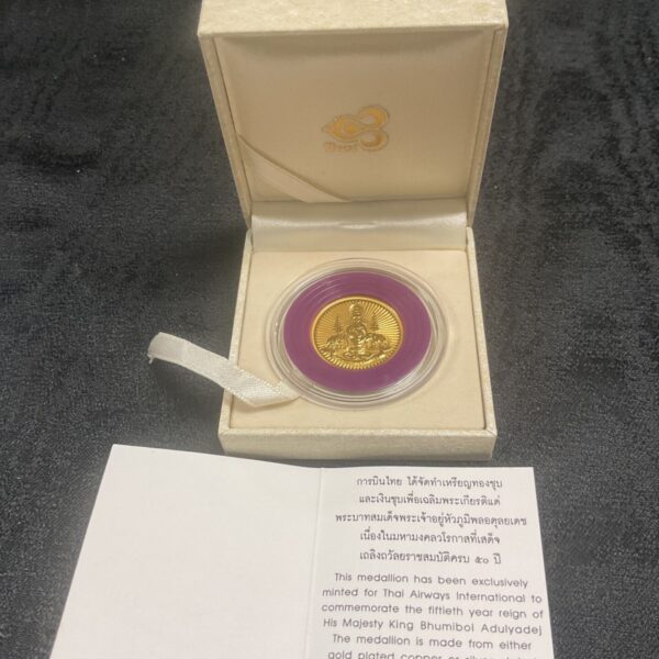 Thai Airways commemorative medal featuring King Bhumibol Adulyadej.