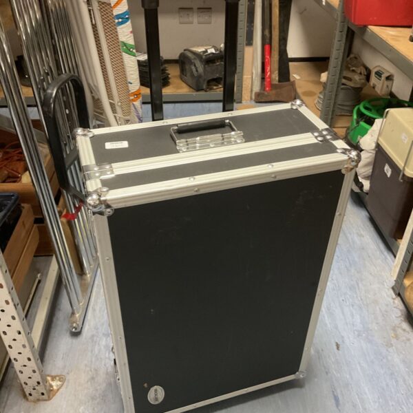 Black Thomann flight case with wheels and trolley handle.