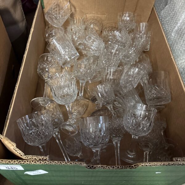 Collection of vintage Thomas Webb crystal glasses with cut patterns.