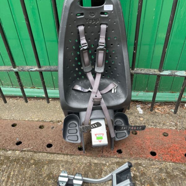 Black Thule Yepp Maxi rear bike seat with harness.
