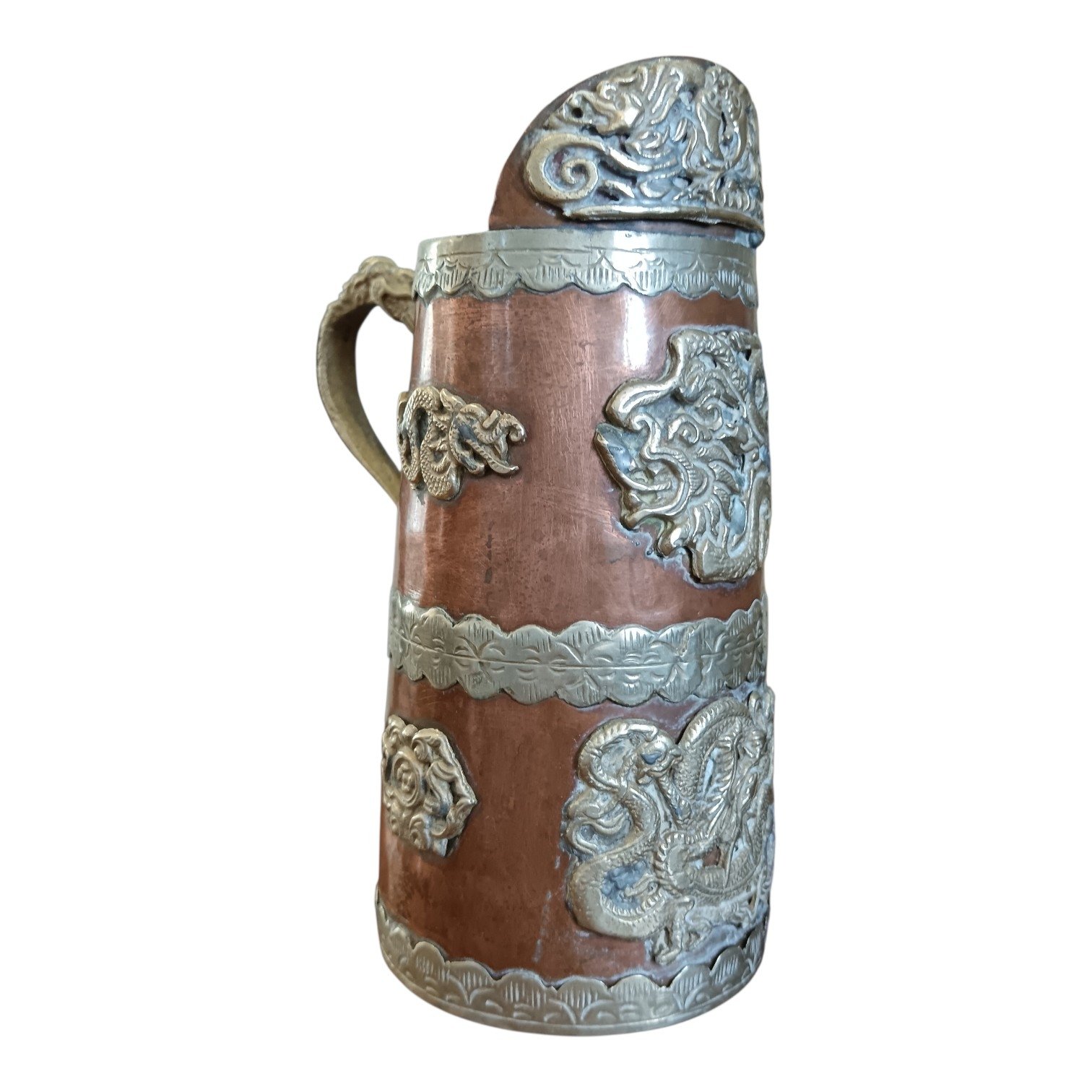 Vintage Tibetan pitcher with dragon handle and silver detailing.