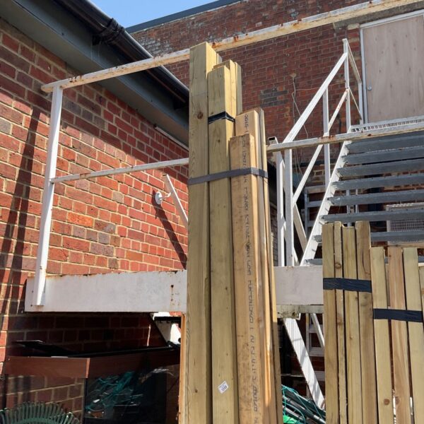Stacked timber bundles ready for building projects.