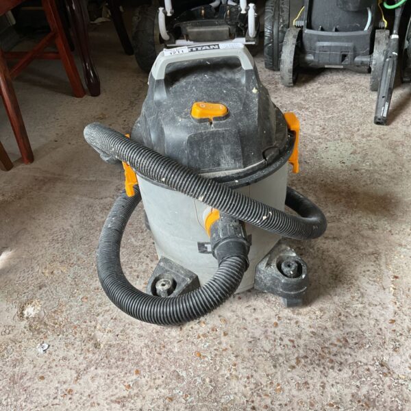 Used Titan Hoover wet and dry vacuum cleaner with hose.