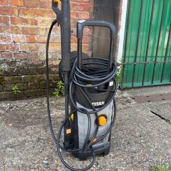 Titan TTB1800PRW pressure washer with hose and lance.