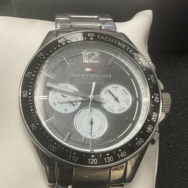 Tommy Hilfiger chronograph watch with stainless steel bracelet and grey dial.