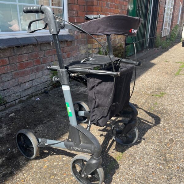 Grey Topro Troja rollator with basket and padded seat.
