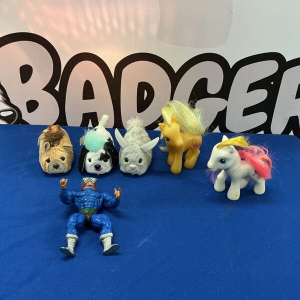 Assorted vintage toy lot including He-Man, My Little Pony, and FurReal Friends.