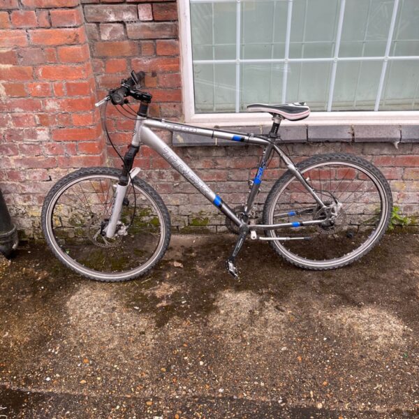Silver and blue Trek 6500 mountain bike for sale.