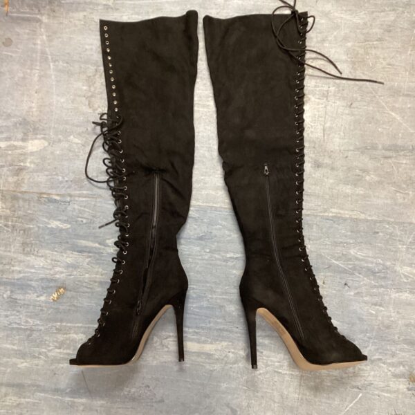 Stylish size 8 Truffle Collection thigh high boots with lace-up front.
