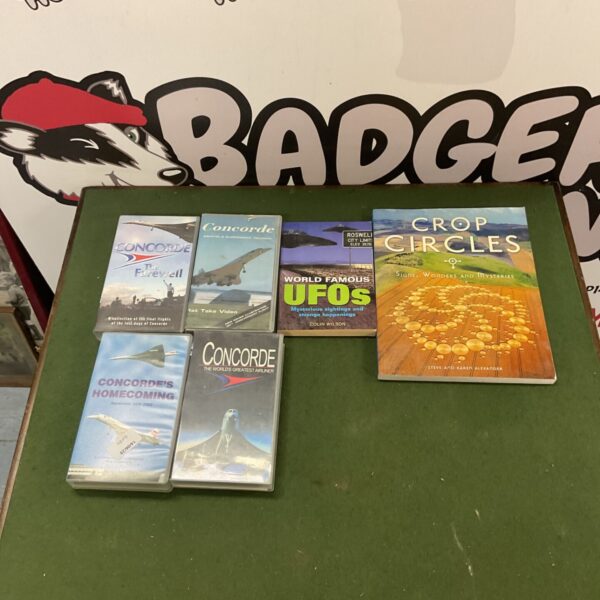 Books and VHS tapes about UFOs, crop circles, and Concorde.