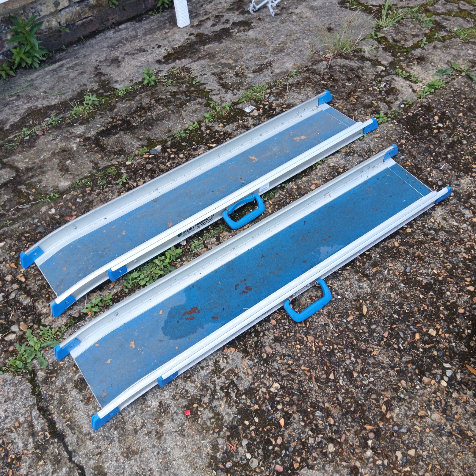 Pair of aluminium Unwin Freeway 21 vehicle ramps for loading.