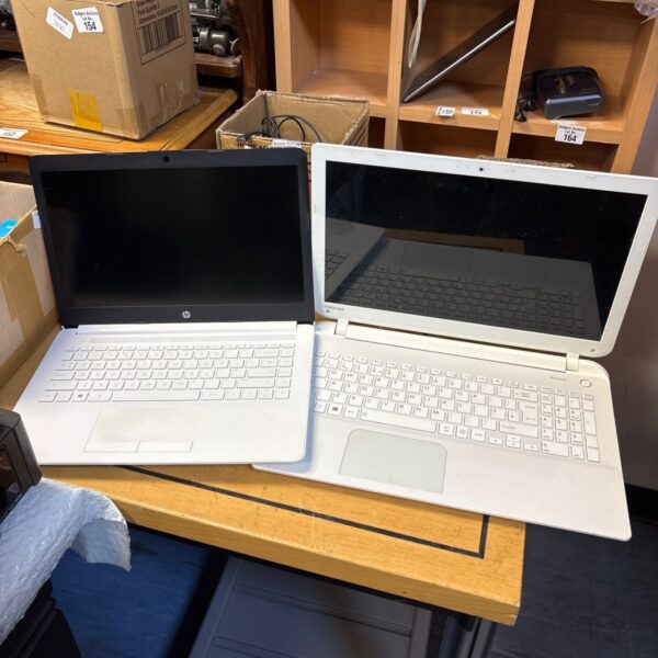 Used laptops including Toshiba and HP models for repair or parts.
