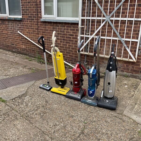 Job lot of vintage vacuum cleaners including a Hoover.