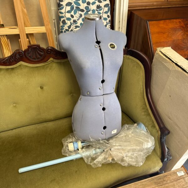 Vintage Venus dress form mannequin with adjustable features and stand.