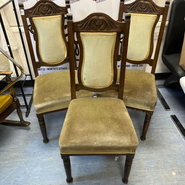 Set of three Victorian mahogany dining chairs with velvet upholstery.