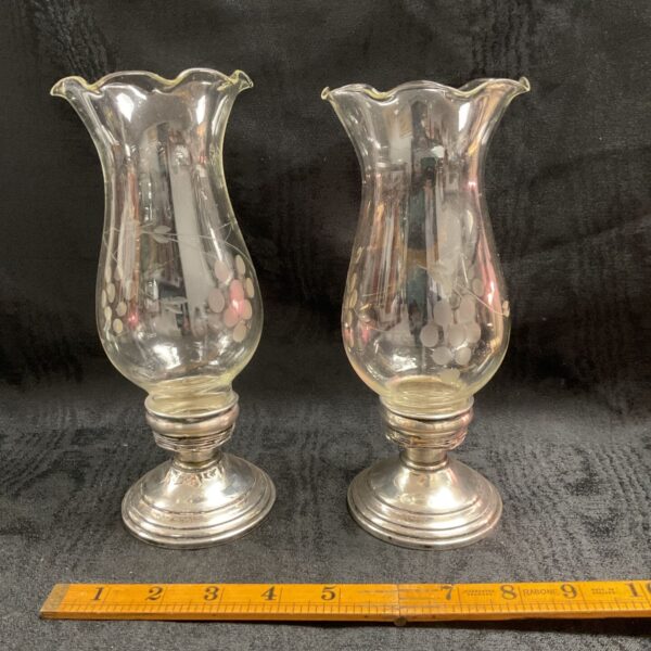 Antique Victorian silver candle holders with etched glass.