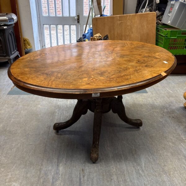 Antique Victorian walnut coffee table with inlaid top.