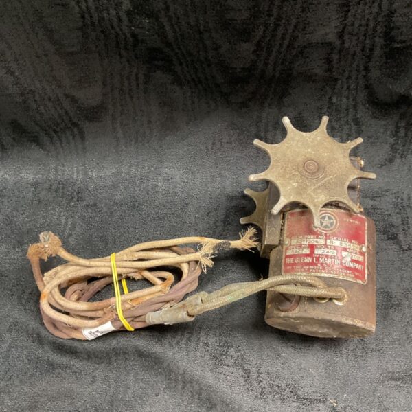 Vintage aircraft ammunition feed motor with electrical connector.