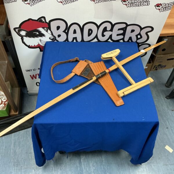 Vintage archery set with wooden bow and quiver.