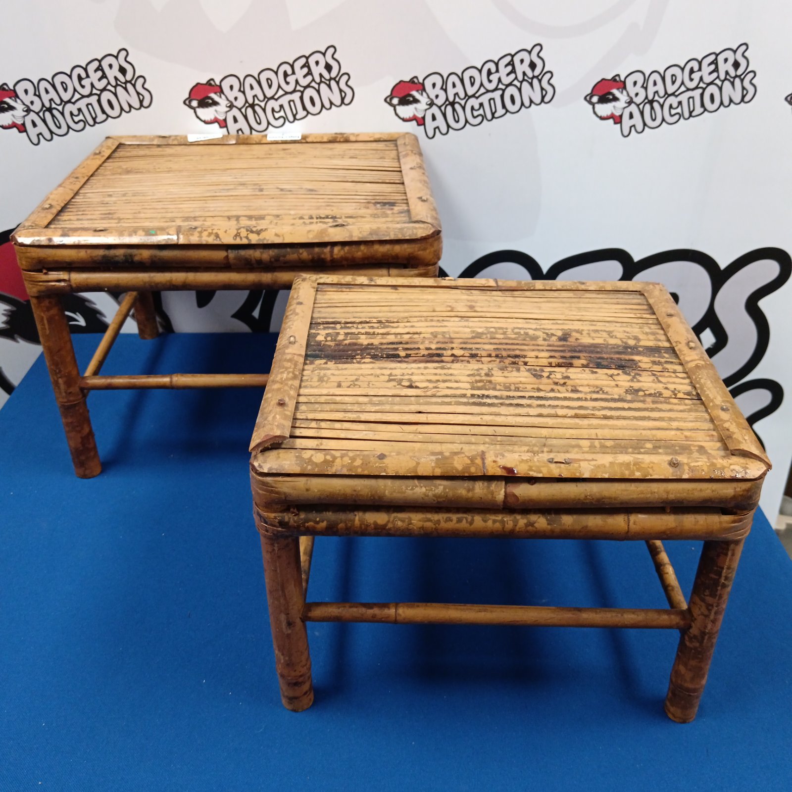 Vintage nest of three bamboo tables with woven tops.