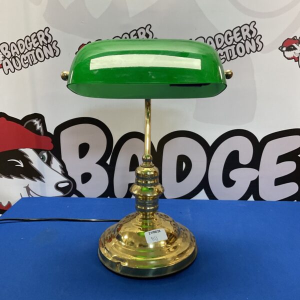 Vintage bankers lamp with green glass shade and brass base.