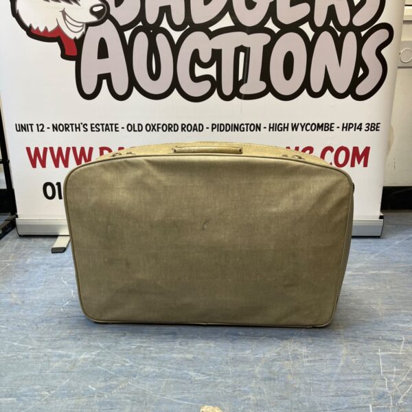 Vintage beige suitcase with metal clasps, retro travel luggage.