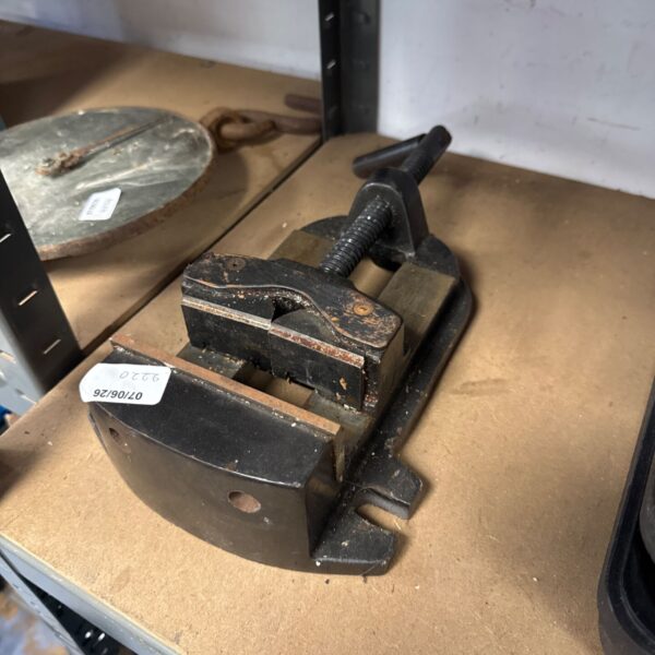 Vintage bench clamp for metalworking, showing signs of wear.