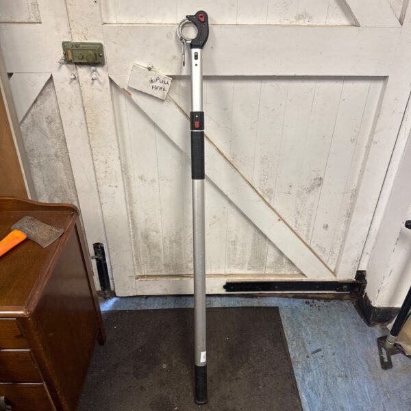 Vintage boat hook with extending pole for nautical mooring.