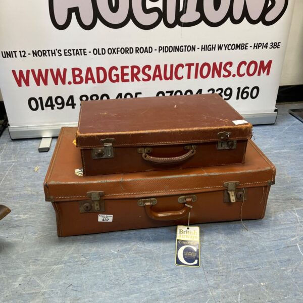 Vintage brown suitcase with a leather handle, ideal for collectors.