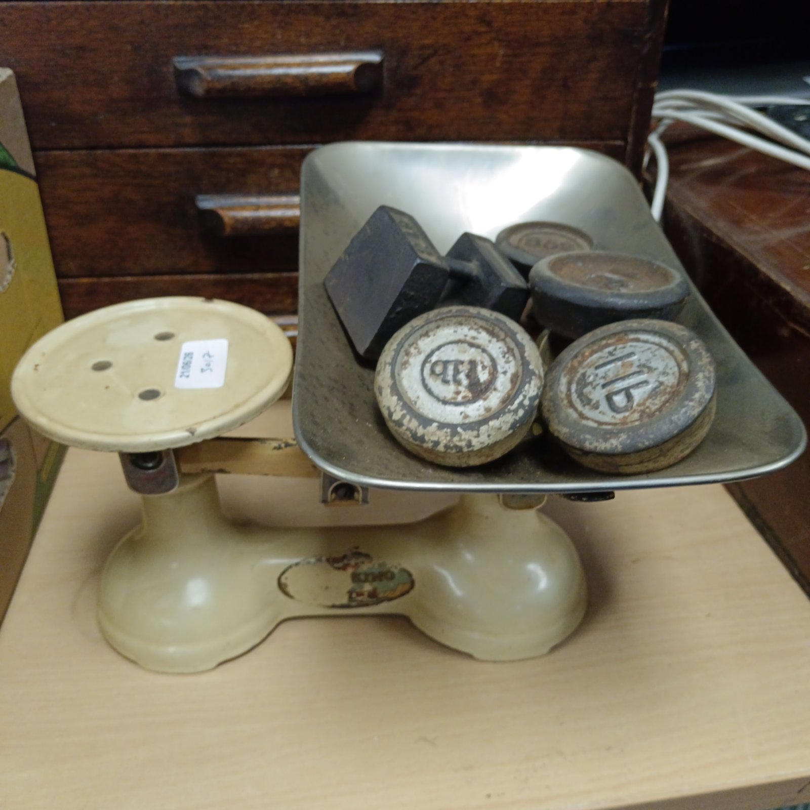 Vintage cast iron scales with weights for kitchen or display.