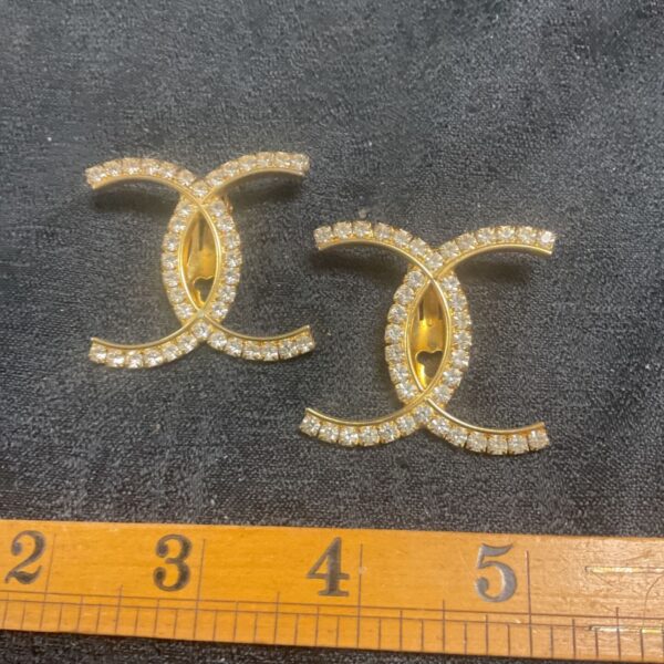 Vintage CC Whitestone gold tone clip-on earrings.