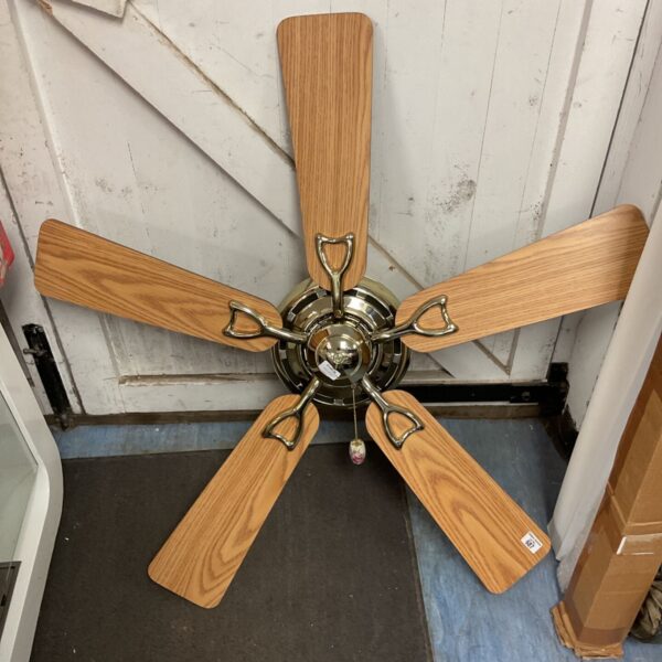 Vintage wooden blade ceiling fan with chrome housing.