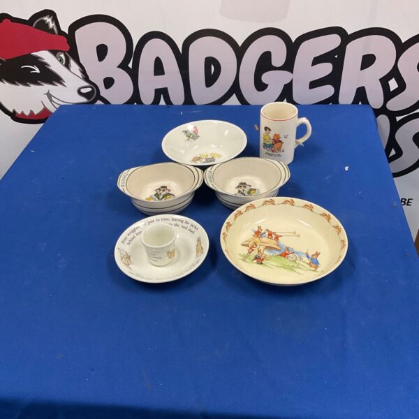 Vintage children’s breakfast set with colourful nursery rhyme illustrations.