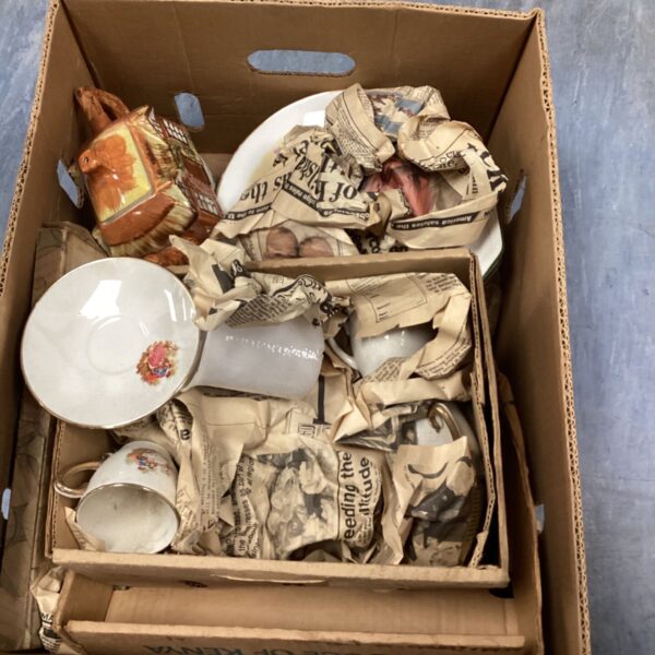 Vintage china lot featuring a clown plate and assorted porcelain pieces.