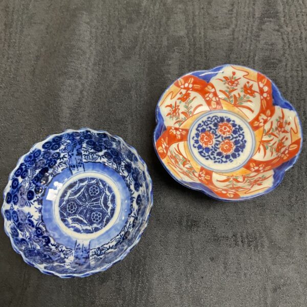 Blue and white vintage Chinese porcelain bowl with floral design.