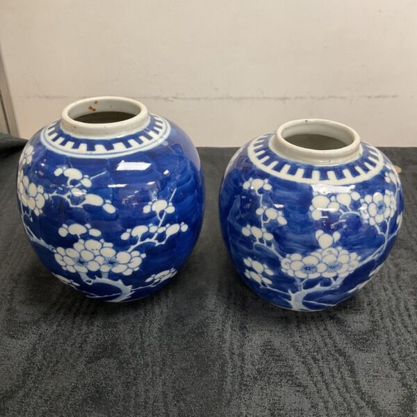 Pair of vintage Chinese ginger jars with floral design.