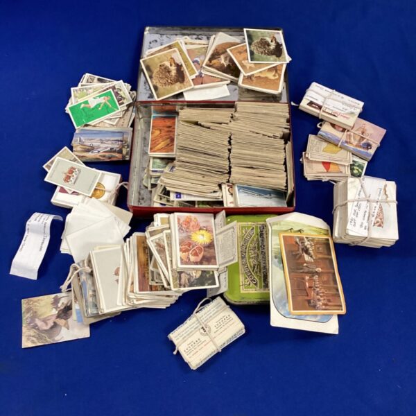 Large collection of vintage cigarette cards for collectors.