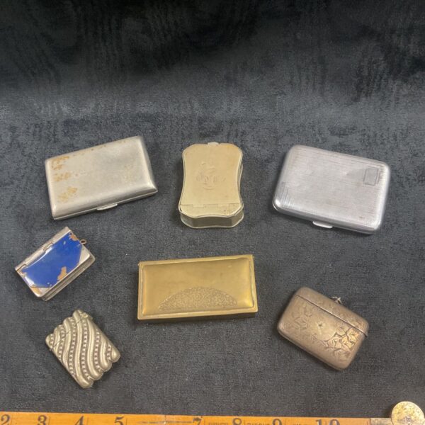 Lot of vintage cigarette and vesta cases with engraved details.