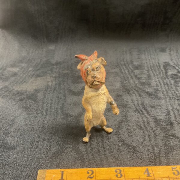 Vintage cold painted dog figurine, detailed cast metal sculpture.