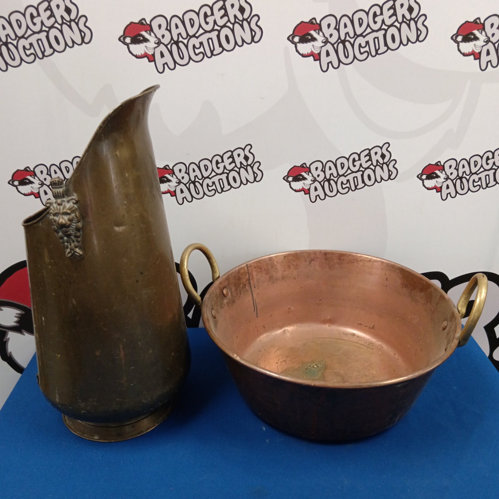 Vintage copper coal scuttle with lion head handles.