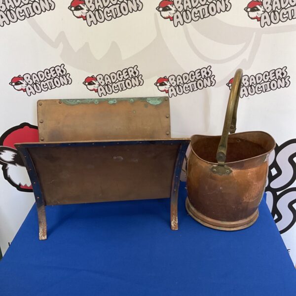 Vintage copper coal scuttle with magazine rack, antique fireplace accessory.