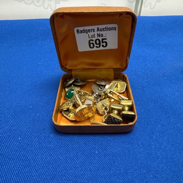 Vintage gent's cufflinks selection on display.