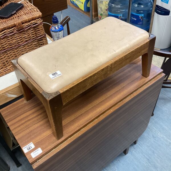 Vintage Czech gym bench with worn leather and wooden frame.