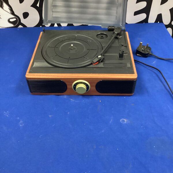 Vintage Daren record player with wooden cabinet and turntable.