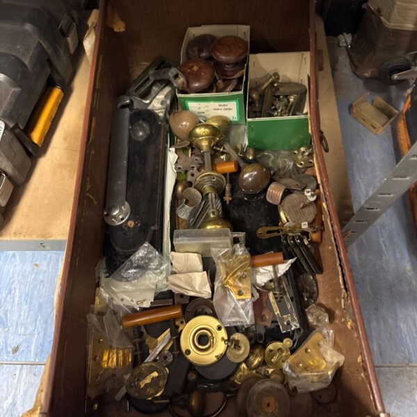 Vintage door furniture lot with brass knobs and handles.
