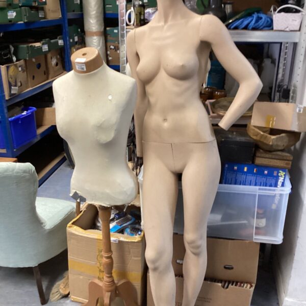 Vintage dress form mannequin on wooden tripod base.