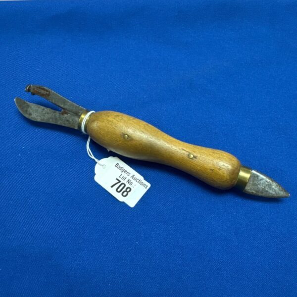 Vintage F G Pearson & Co can opener with wooden handle.