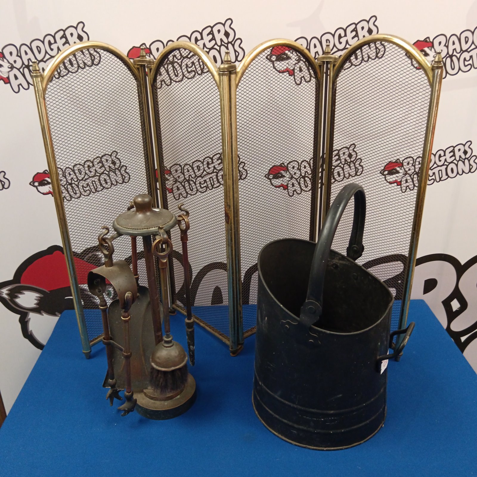 Vintage fireplace set with brass companion tools and metal scuttle.